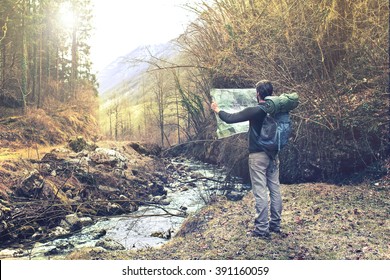 Lost Man Observing Map To Find The The Right Way