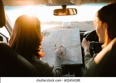 Lost With Map Two Young Asia Woman Friends In Car Enjoy Road Trip