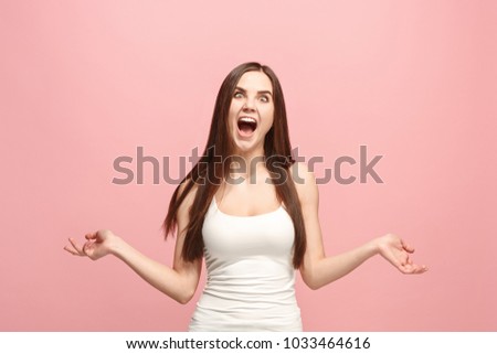 I lost my mind. The squint eyed woman with weird expression. Beautiful female half-length portrait isolated on pink studio backgroud. The crazy woman. The human emotions, facial expression concept.
