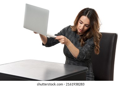 Lost And Not Found - Businesswoman Looking Under Her Laptop To Seek Some Paper She's Missing