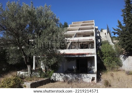 Lost places: An unfinished hotel complex in Izmir, Turkey with 96 apartment rooms is left to decay. Terrace construction already overgrown by nature lies in ruins