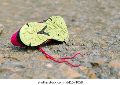 Lost Running Shoe. Tread Of Running Shoe On Rough Sourface. Running Concept.