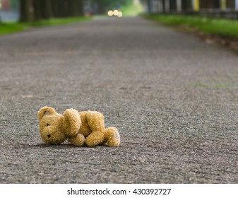 Lost Teddy Bear Lying Alone On The Road