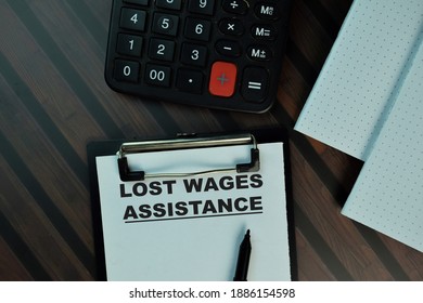 Lost Wages Assistance Write On A Paperwork Isolated On Wooden Table. Business Or Finance Concept