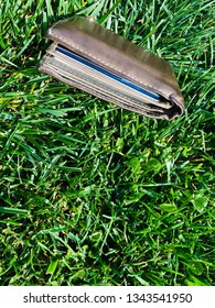 Lost Wallet On The Grass, Full Of Credit And Debit Cards.