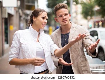 Lost Woman Asking Stranger At The Street In An Unfamiliar City