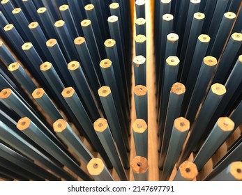 lots of blue pencils put on the same floor Evenly spaced, taken from above, education, writing, orderliness. - Shutterstock ID 2147697791
