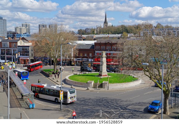 Lots of buses in\
the city center take people. Shot from above. Traffic in downtown\
Walsall. April 15, UK 2021