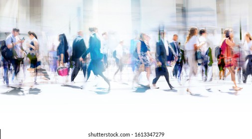 Lots of business people walking in the City of London. Blurred image, wide panoramic view of the crossroad with people at sunny day. London, UK - Shutterstock ID 1613347279