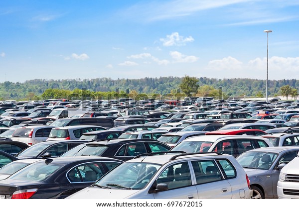 Lots of cars parking\
at airport carpark
