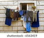 Lots of clothes drying at the window