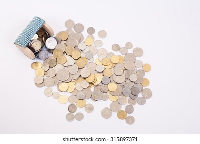 A Lots Of Coins Money From Small Box With White Background In Top View