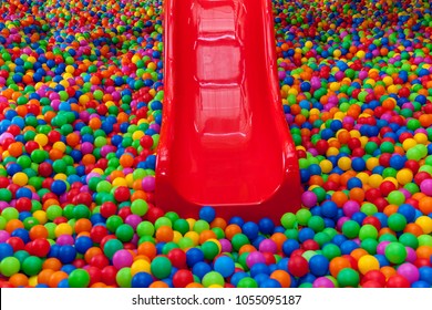 lots of colored balls in a playground ball pool.Ball with colorful plastic balls in children entertainment center. Pool with bright balls background.