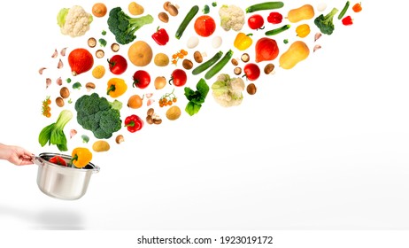 Lots of colorful bright vegetables with eggs flying into stainless steel pot held by woman hand,on white.Healthy food,vegetarian diet cooking course concept.Copy space.Grocery store horizontal banner - Shutterstock ID 1923019172