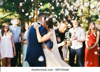 Lots Of Confetti Fall Over Wedding Couple Dancing On The Porch