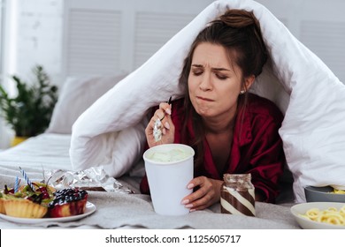 Lots Of Desserts. Heartbroken Woman Eating A Lot Of Desserts Because Of Depression And Huge Stress At Work