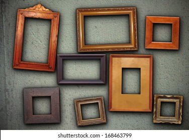 Lots Of Empty Picture Frames Hung On Green Wall Ready For Your Design