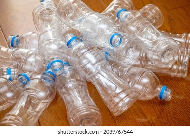 Lots of empty plastic bottles on the floor