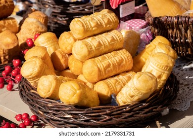 Lots Of Fresh Tasty Polish Oscypki, Pieces Of Oscypek Smoked Sheep Cheese In A Basket, Group Of Objects, Nobody, No People, Closeup, Detail. Traditional Polish Food Festival Market, Polish Culture