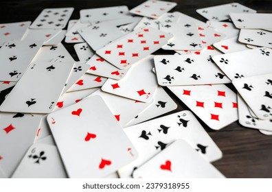 Lots of game cards . There are game cards scattered on the table. - Powered by Shutterstock