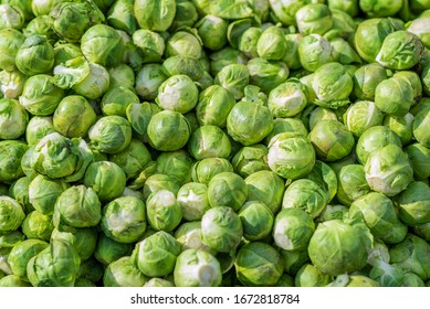 Lots of green brussels sprouts in the air