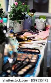 lots of makeup on the table