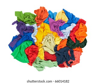 Lots of messy colorful clothes, view from above, isolated on white background.
