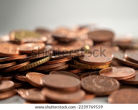 Lots of metal coins. A bunch of euro cents. Close-up.