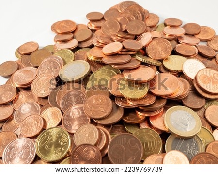 Lots of metal coins. A bunch of euro cents. Close-up.