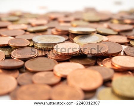 Lots of metal coins. A bunch of euro cents. Close-up.