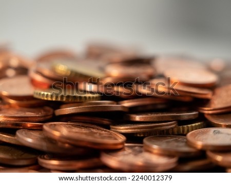 Lots of metal coins. A bunch of euro cents. Close-up.