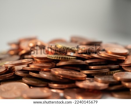 Lots of metal coins. A bunch of euro cents. Close-up.