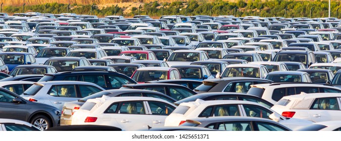 Lots of new cars for sale in a parking