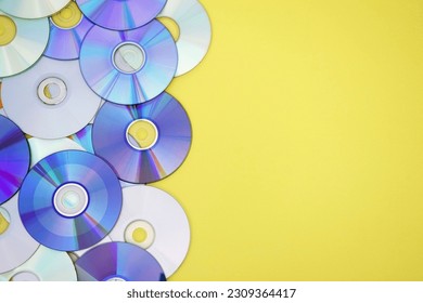 Lots of old CDs are laid out as a background. Bright background. Vintage. - Shutterstock ID 2309364417