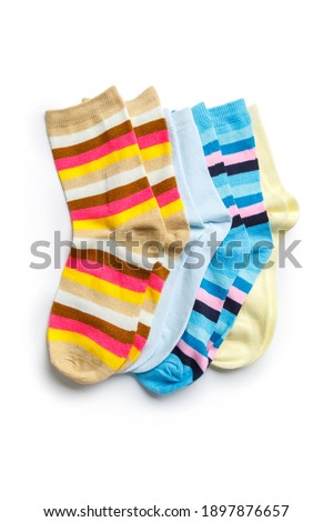 Lots of Pairs of new knitted sports socks isolated on white background.