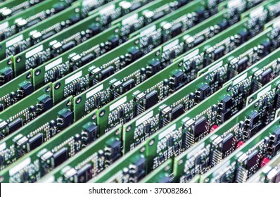 Lots of Printed Circuit Boards With Mounted and Soldered Componentry Arranged in Rows Together. Horizontal Image