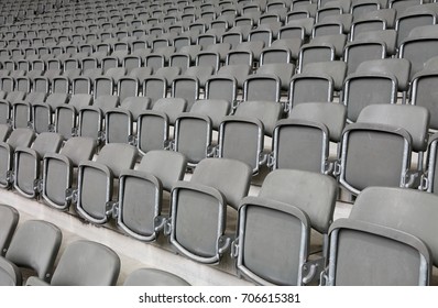 Lots Of Reclining Chairs On The Stadium Bleachers With No People Before The Sporting Event