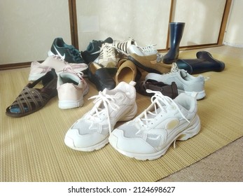 Lots Of Shoes Such As Athletic Shoes Being Decluttered