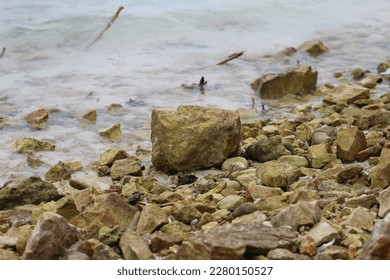 LOTS OF SMALL STONES ON THE BEACH - Shutterstock ID 2280150527