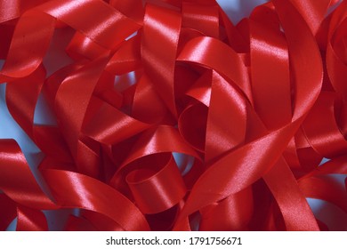 Lots Of Tangled Red Ribbons. Red Ribbon Background