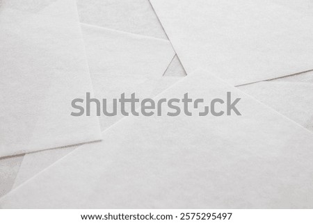 lots of thin white paper overlapping each other