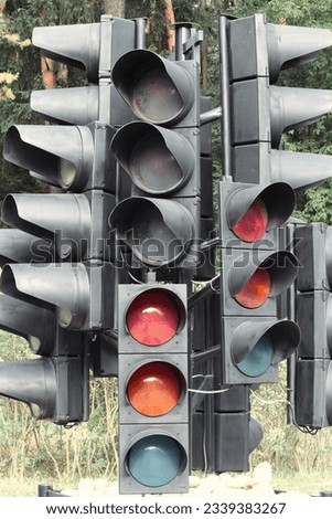 Lots of traffic lights. Confusion and misunderstanding of the rules. Incomprehensible signs. Driving training.