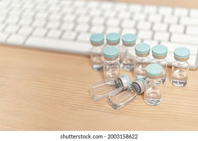 Lots Of Vaccine Vials On The Desk