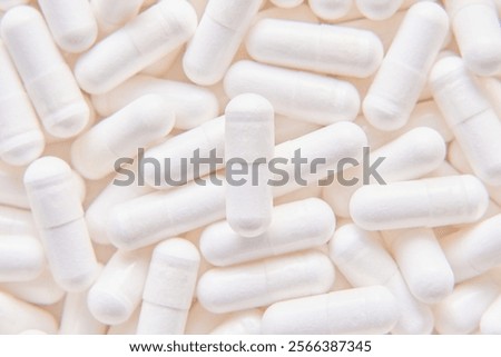 Lots of white capsules background.