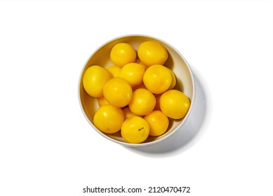 Lots Of Yellow Plums In A White Deep Dish On A White Background, View From Above