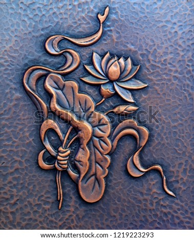 Lotus sculptures on metal panels