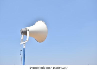 A Loud Speaker Outside Under Blue Sky