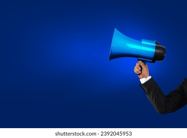 Loudhailer, hands holding megaphone. Announcement, advertising, public hearing concept. Mockup design with loudspeaker, background with blank empty space for copy space