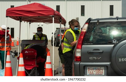 Louisburg, NC- United States- 04-28-2021: Volunteers Staff A Drive Thru Vaccine Clinic For COVID At Triangle North Executive Airport. 