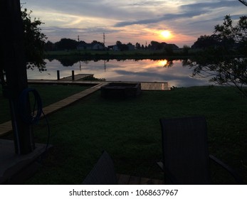 Louisiana Clouds Reflected In The Bayou In The Heart Of Cajun Country.